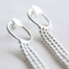 Long silver curving earrings