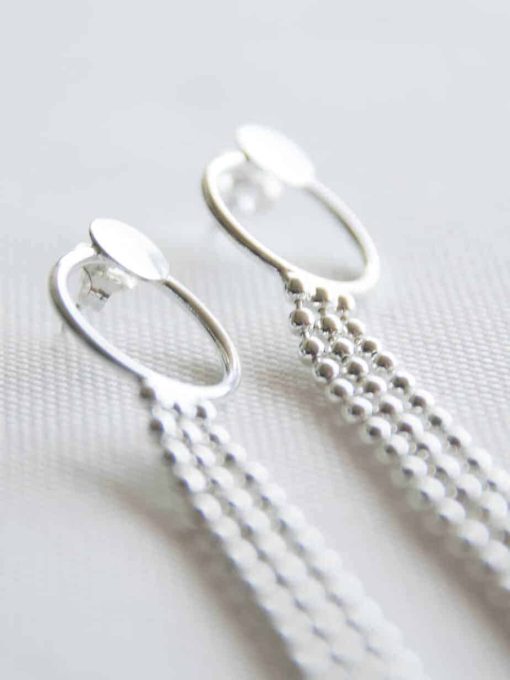 Long silver curving earrings