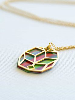 A delicate colored lotus necklace