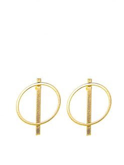 Golden circle earrings attached to the ear